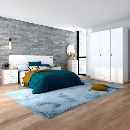 Dormitorio completo con cama de cabecero blanco y ropa de cama azul petroleo junto a armario blanco y mesitas de madera clara