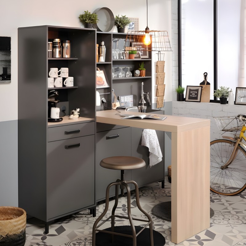Escritorio modular gris antracita con estantería abierta y cajones integrados junto a mesa auxiliar madera clara en ambiente de 