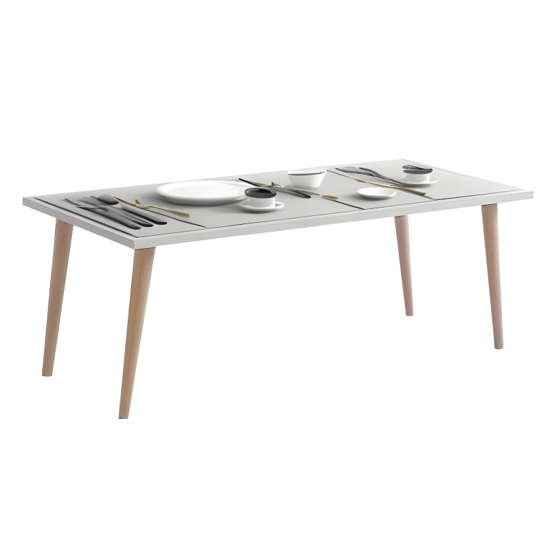 Mesa de comedor rectangular blanca con patas de madera clara y cubierto con platos y cubiertos