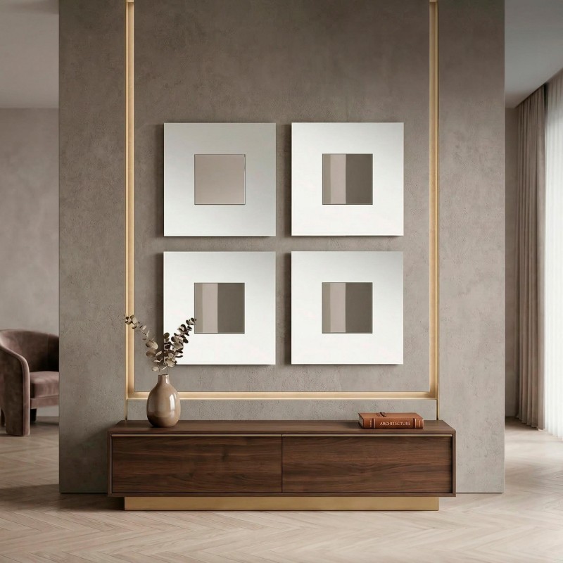 Consola baja madera oscura con base dorada en ambiente con pared cemento y cuadros blancos