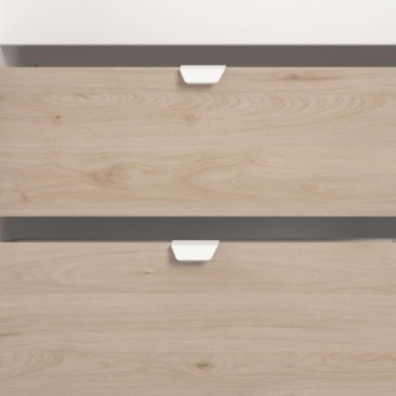 Detalle de módulo de almacenamiento con cajones de madera clara y tiradores blancos con estructura gris antracita