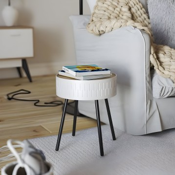 Mesita auxiliar redonda blanca con tablero de madera y patas negras en ambiente de salón junto al sofá