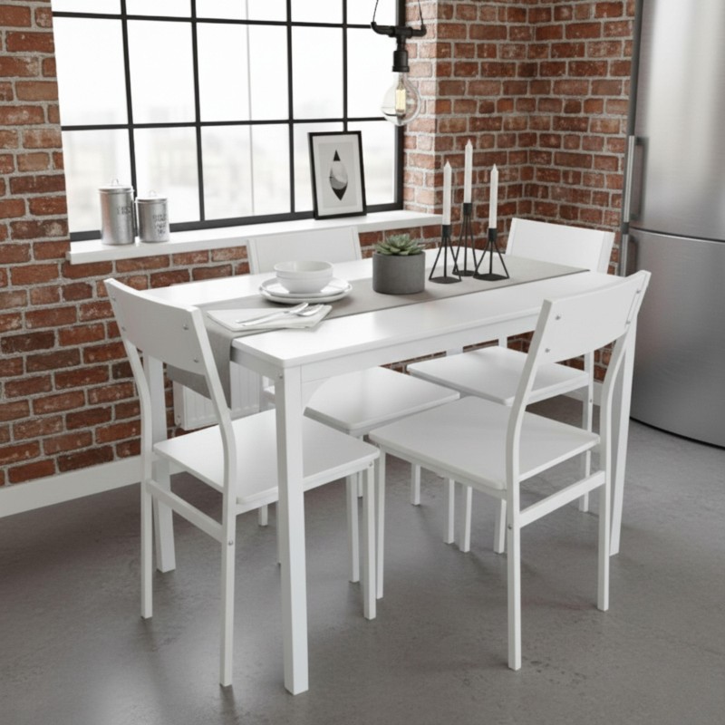 Conjunto de comedor blanco con mesa rectangular y cuatro sillas en ambiente loft con pared de ladrillo