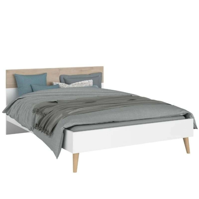 Cama matrimonial con estructura blanca y cabecero en madera clara con almohadas azules y grises