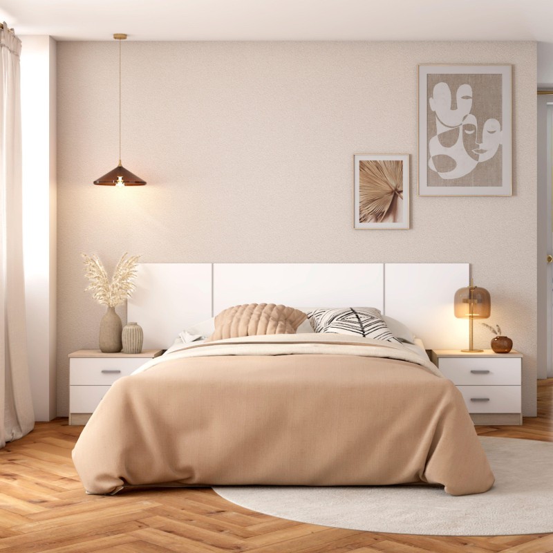 Cama matrimonial con cabecero tapizado blanco y almohadas decorativas en ambiente de dormitorio moderno
