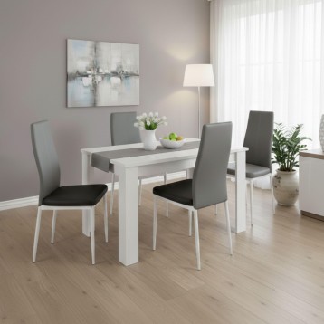 Conjunto de comedor con mesa blanca y cuatro sillas tapizadas en gris y negro en ambiente de salón luminoso