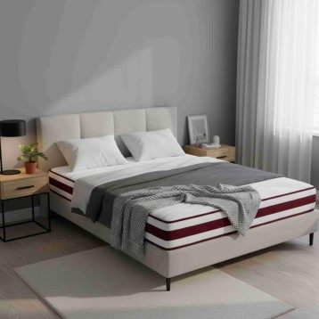 Cama doble con cabecero tapizado beige y colchón de capas blancas con franjas burdeos en dormitorio moderno