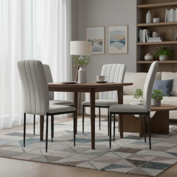 Comedor con mesa de madera oscura y sillas tapizadas en gris claro con costuras verticales y patas metálicas negras